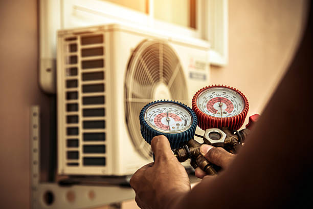 Professional Hvac technician working in Vernon, AL
